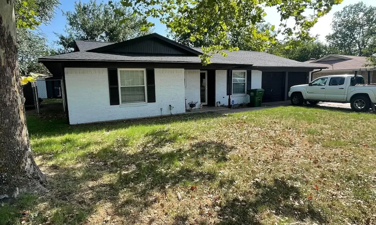 Professional roofing crew working on a residential roof in Indio